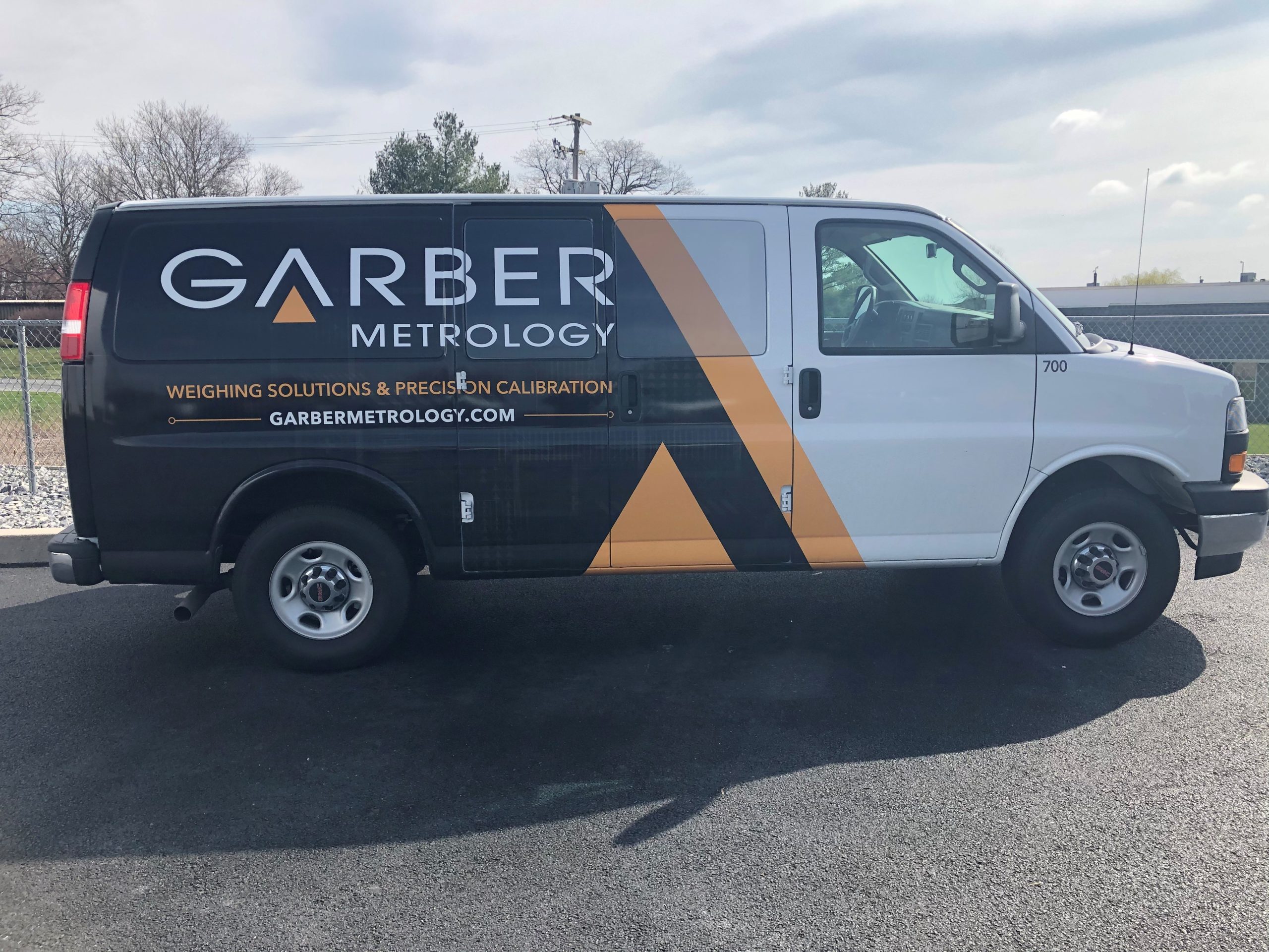 black yellow and white work van