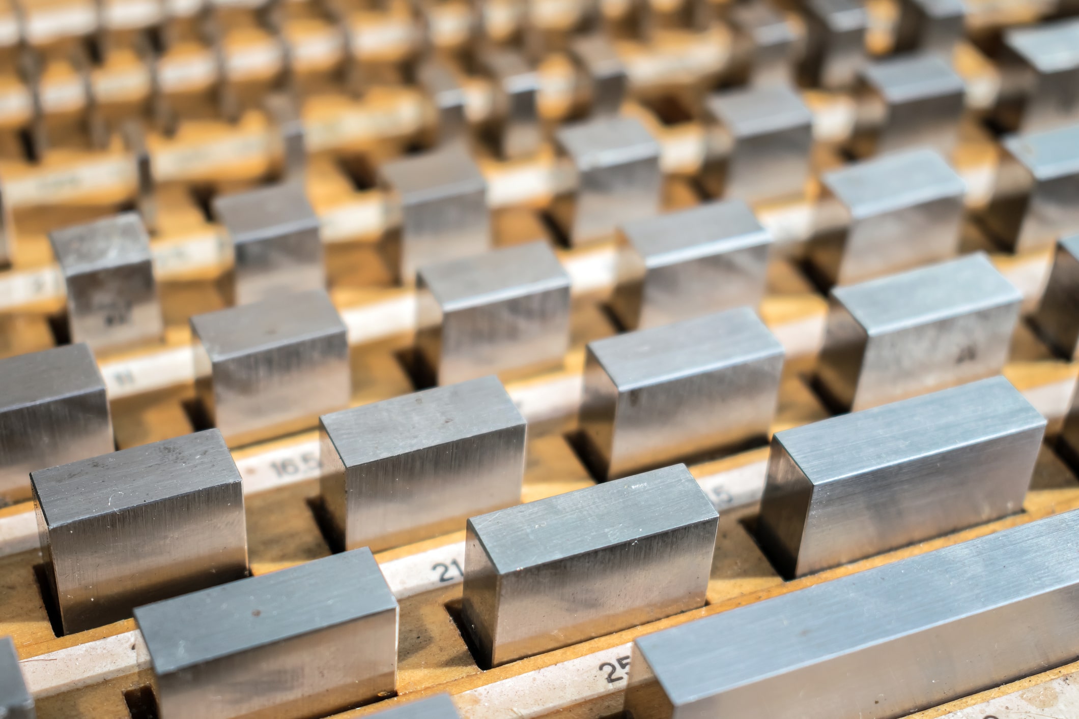 a row of different sized metal blocks